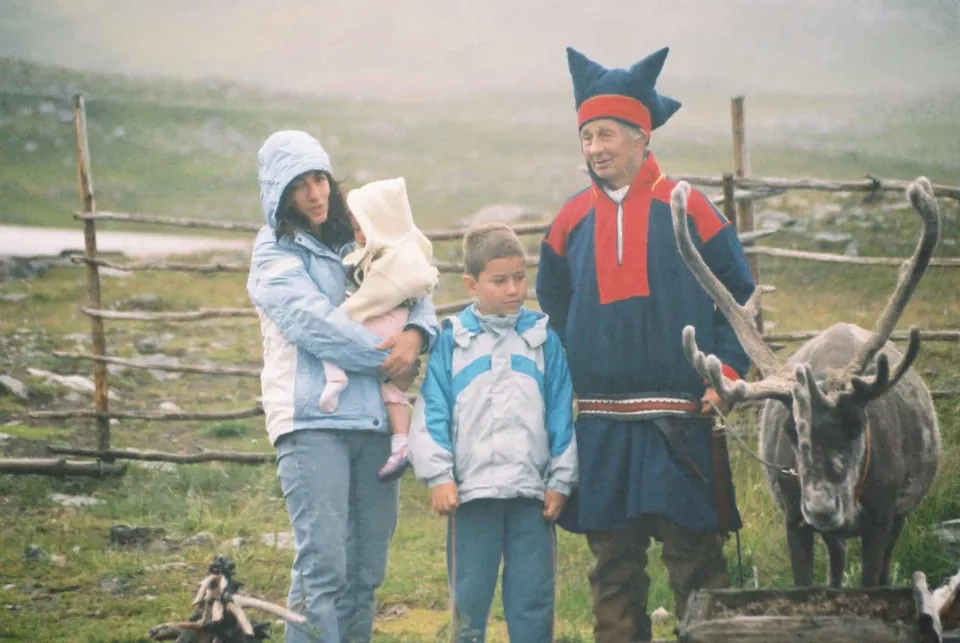 Sami people with a reindeer